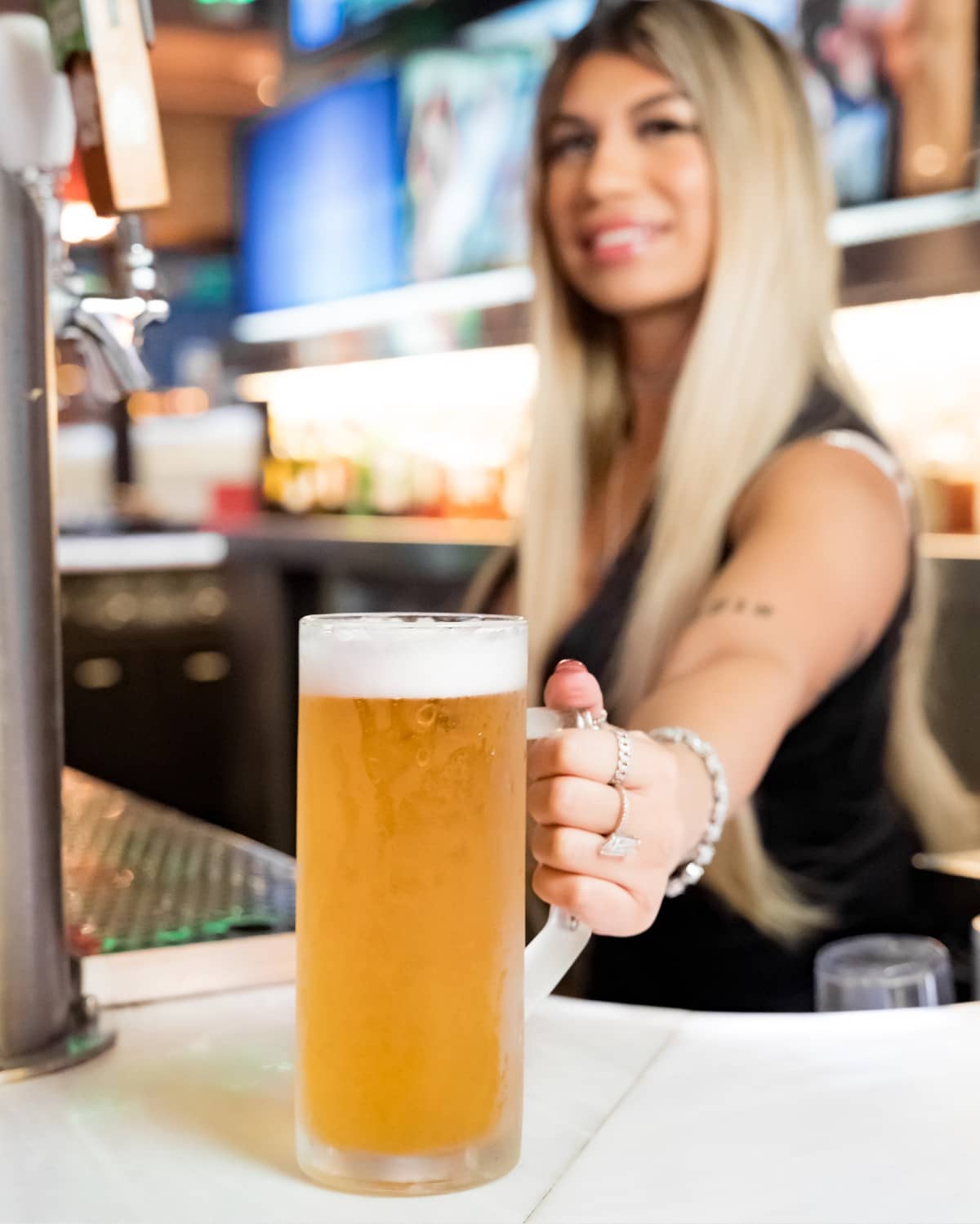 Barmaid serving beer Barmaid serving beer